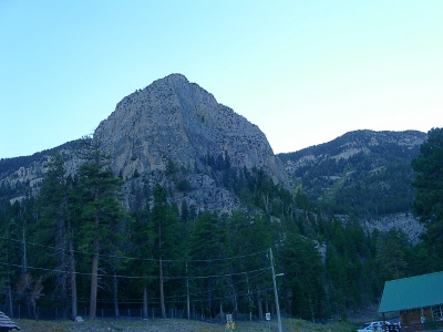 [Large domed-shaped rock in the hillside.]